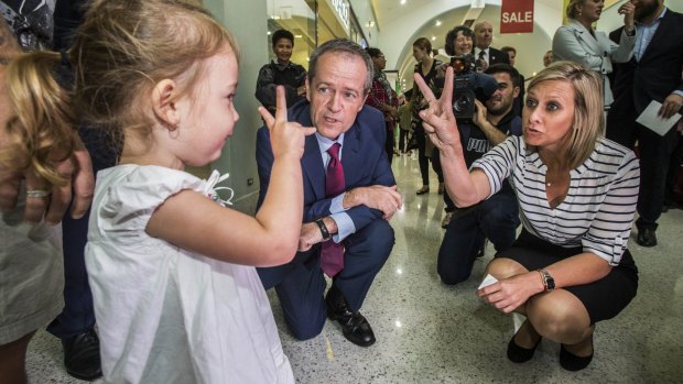 V for victory? Opposition Leader Bill Shorten in Morayfield on Tuesday with likely Longman MP-elect Susan Lamb.