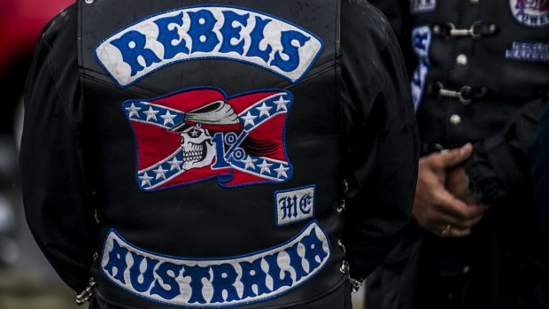 The man phoned triple-0 from his bathroom and said Rebels bikies were in his living room, a court was told.