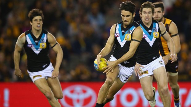 Under-achievers: Port Adelaide's Chad Wingard gets set to kick upfield.
