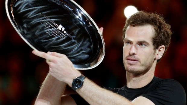 The bridesmaid again: Andy Murray holds the runner-up trophy after yet another loss in an Australian Open final.