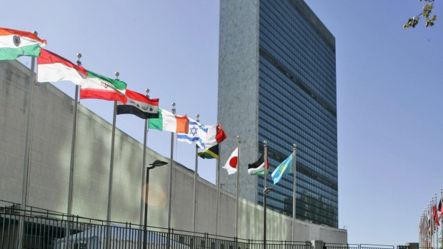 Flags of member nations flying outside United Nations headquarters in New York. 
