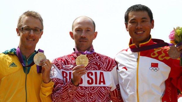 Australian silver medallist Jared Tallent besides Russian gold medallist Sergey Kirdyapkin and bronze medallist Tianfeng Si of China during the medal ceremony for the Men's 50km Walk at the 2012 London Olympics.