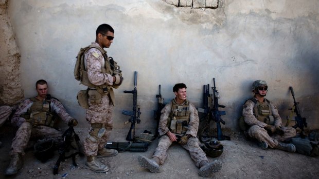 US Marines take a break during a patrol in Sangin, south of Kabul, Afghanistan, in 2011.