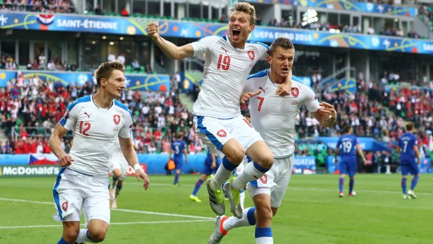 The Czech Republic's Tomas Necid, centre,  celebrates with Milan Skoda and Ladislav Krejci after he scores from the penalty spot to secure a point against Croatia.