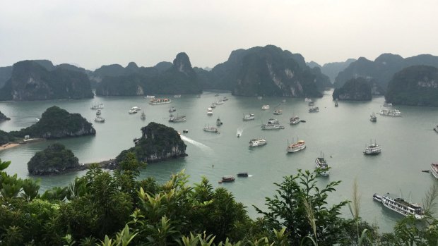 Emerald waters and towering limestones: Ha Long Bay looks the same as it did 100 years ago, minus the many tourists boats that now visit the bay.