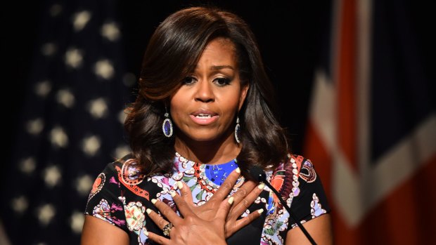 Michelle Obama told the summit attitudes must change to ensure all girls get an education.