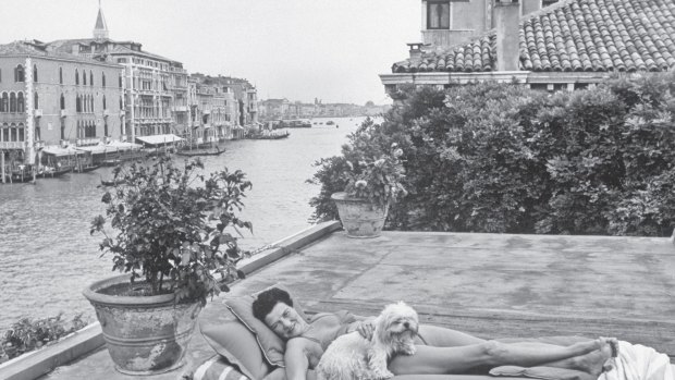 Peggy Guggenheim on the roof top of her house on the Grand Canal. 