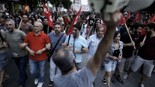 A protester shouts anti-European slogans with a megaphone during an anti-austerity demonstration in Thessaloniki, Greece.