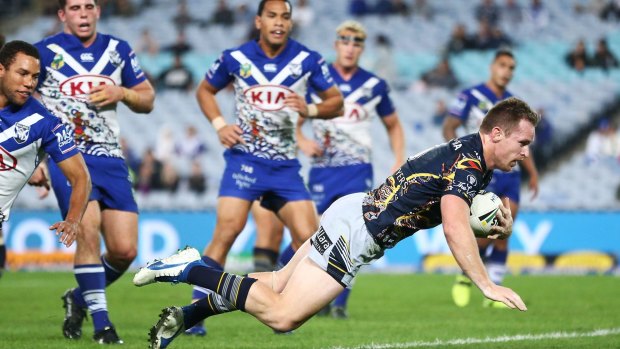 Blissful backup: Man of the moment Michael Morgan scores one of his own against the Bulldogs, in addition to setting up a number of others while filling in for Johnathan Thurston at five-eighth.