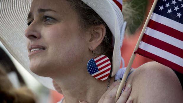 Kimberlee Crawford, of Los Angeles, listens to a speaker during the Tea Party Patriots rally.