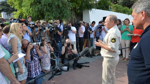 Russian President Vladimir Putin speaks to Crimea residents and the media after plunging into the Black Sea aboard a submersible craft.