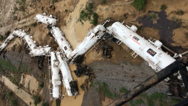 An Aurizon freight train lies beside the tracks after derailing near Julia Creek in Queensland's north-west.