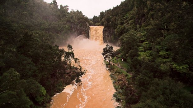 Hunua Falls in peak flow during heavy rain after the tail end of Cyclone Debbie lands in New Zealand.