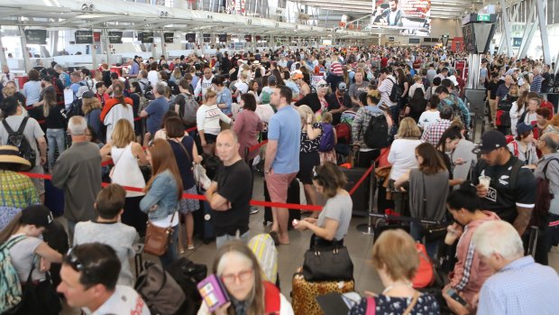Crowds gathered at Sydney Airport after delays stemming from a "technical issue".