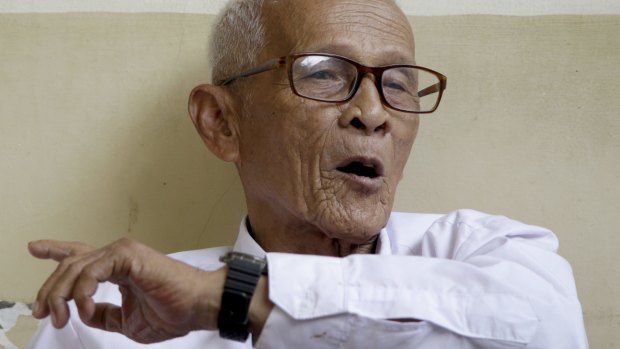 Kusnendar, a survivor of the 1965 crackdown, speaks to a reporter at a nursing home in Jakarta in September 2015. 