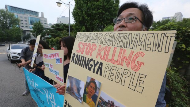 Human right activists protest against the ethnic cleansing of the Rohingya Muslim minority.