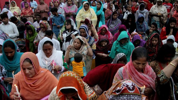 Pakistani Christians take part in a prayer ceremony for the victims of Sunday's suicide bombing, at St Anthony's Church in Lahore on Tuesday.