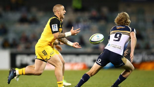 TJ Perenara of the Hurricanes passes during the Super Rugby Quarter Final match between the Brumbies and the Hurricanes at Canberra Stadium.
