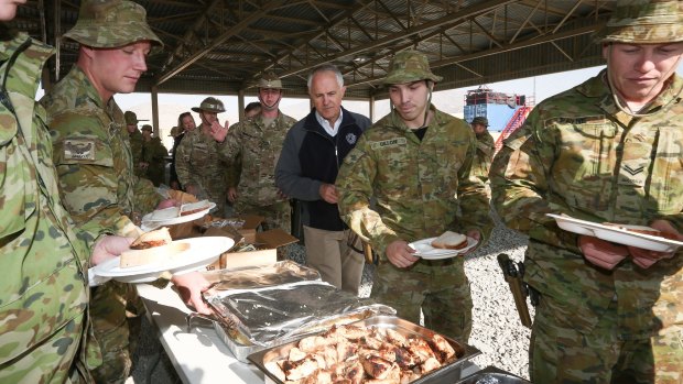 Prime Minister Malcolm Turnbull meets with ADF trainers and force protection troops during a barbecue lunch at the Afghanistan National Army Officer Academy in Kabul.