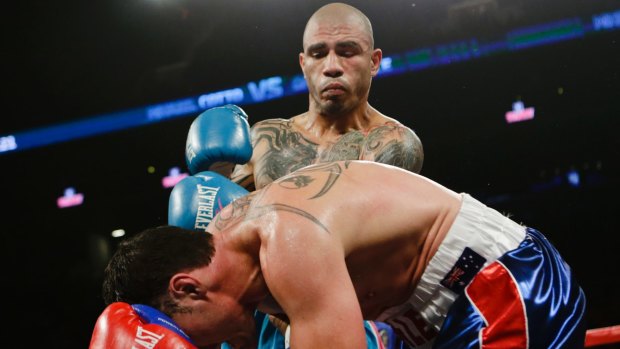 Prize fight: Miguel Cotto stands over Daniel Geale during their fight in 2015. Cotto stopped the Australian in the fourth round.