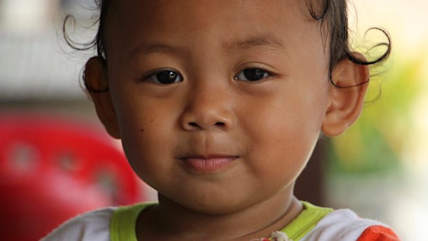 A child in Khmounh, where there are a large number of children in keeping with Cambodia's high national birth rate. 
