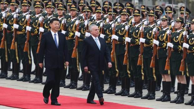 Chinese President Xi Jinping with Brazil's President Michel Temer, right, in Beijing on Friday.