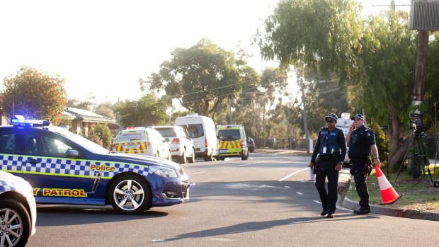 Police seal off Kookaburra Avenue in Werribee on Sunday following reports of a man with a gun.