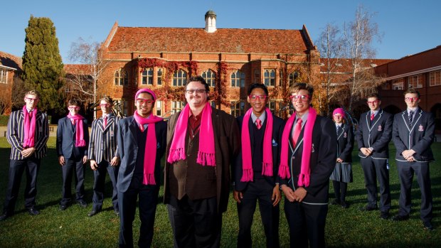 Miguel Salcedo, University of Canberra researcher Dr Robert McCuaig, Emman Salcedo and Nick Dimoff get into the spirit of Pink Day at Canberra Grammar School.