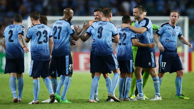 Job well done:  Sydney FC players celebrate their win over Guangzhou in the Asian Champions League at Allianz Stadium.