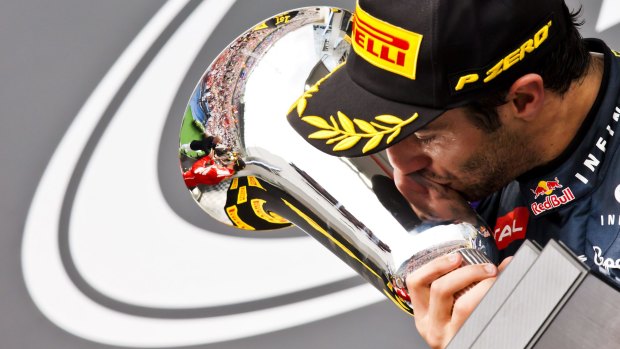 Kiss of success: Daniel Ricciardo after winning the Hungarian Grand Prix in July.