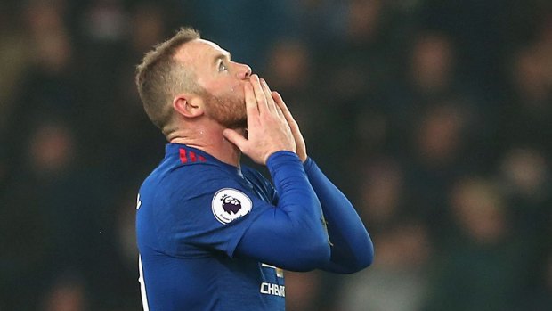 Record: Wayne Rooney celebrates scoring and becoming the club's record goalscorer with 250 goals.