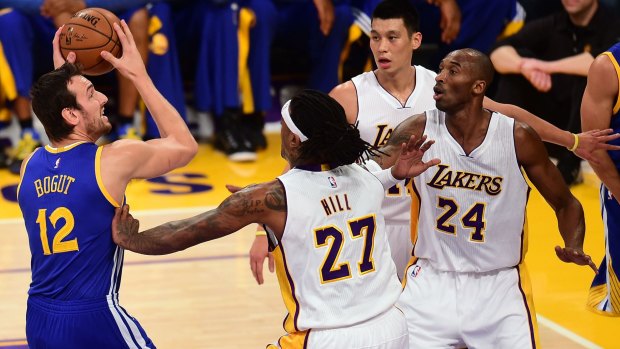 Eyes on the hoop: Andrew Bogut looks to shoot for the Warriors against the Lakers.