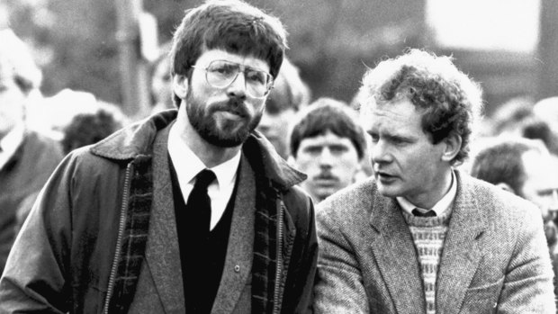 Sinn Fein president Gerry Adams, left, stands with Martin McGuinness at the funeral of an Irish Republican Army commander in Dungannon, Northern Ireland, in May 1987.