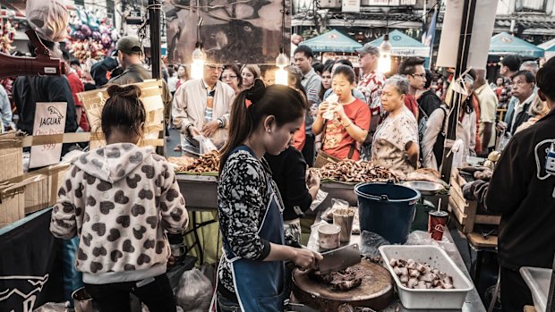 People buying at street food on Yaowarat Road.