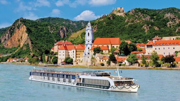 See Europe by river. Here, an APT ship cruises past Durnstein on the Austrian Danube.