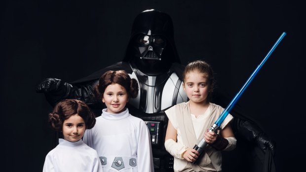 Steve Saville as Darth Vader with daughter Savannah as Rey and sisters Thearia and Anastasia Zachariou as Princess Leia.