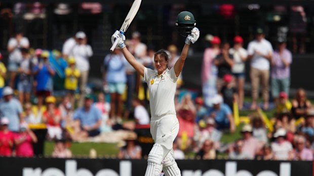 Cracking knock: Ellyse Perry salutes the crowd after reaching triple figures.