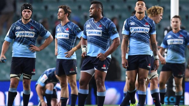Faces tell the story: The Waratahs contemplate defeat to the Jaguares last weekend.