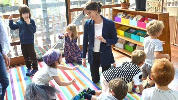 Preshil school teacher Rebecca Lewis engages in imaginary play with her class. 