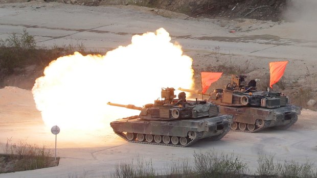 Two US Army M1 A2 tanks fire during South Korea-US joint military live-fire drills at Seungjin Fire Training Field in Pocheon, South Korea, near the border with North Korea, on Wednesday.