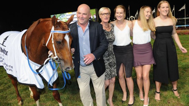 Going out a winner: Trainer Peter Moody poses with his family after Flamberge won  the William Reid Stakes at Moonee Valley on Thursday night.
