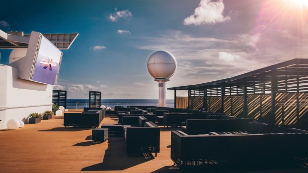 On sea days we head for the cushion-filled cabanas at the new Rooftop Terrace.