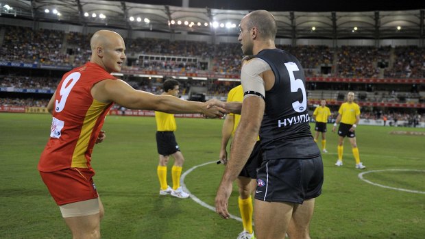 Neither of these men are playing on Sunday but Chris Judd and Gary Ablett led their sides' in the Suns first AFL match against Carlton.