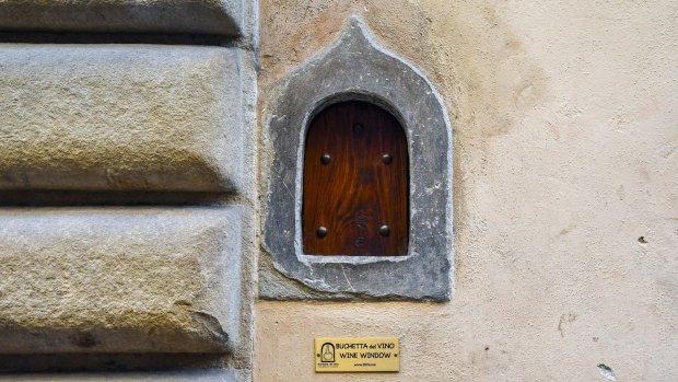 A wine window, used for the sale of wine directly on the street, on the façade of Palazzo Mellini Fossi, Florence.