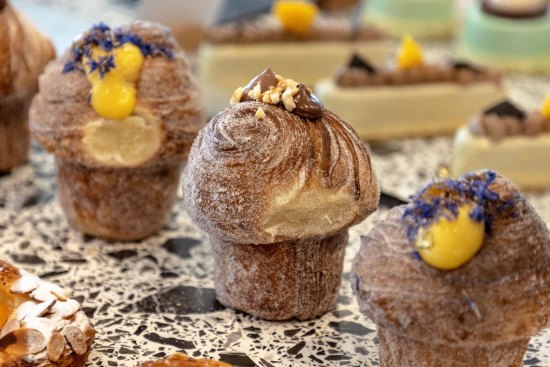 Cruffins and other baked treats cover the counter at the new Penny for Pound.