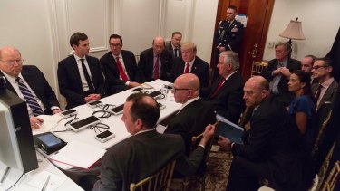 US President Donald Trump receives a briefing on the Syria military strike from his National Security team at Mar-a-Lago in Florida.