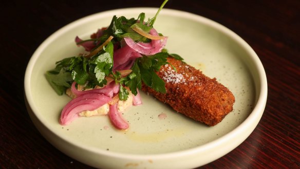 Crumbed pork terrine with pickled onion, gribiche, preserved lemon and parsley salad.