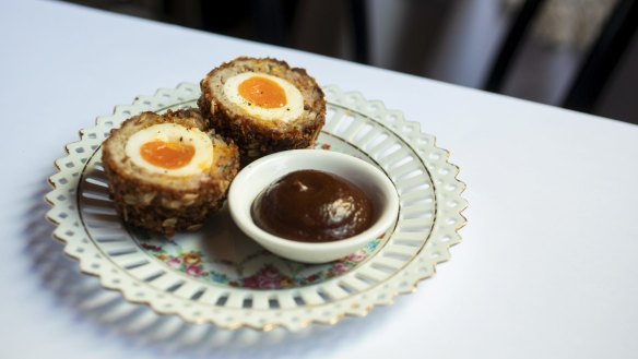 The Milan Cricket Club's scotch egg has a soft-set yolk at its centre.