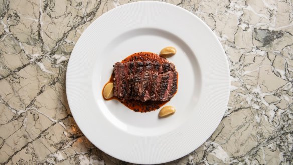 Tagliata of wagyu bavette, sliced like a ruby-red deck of cards.