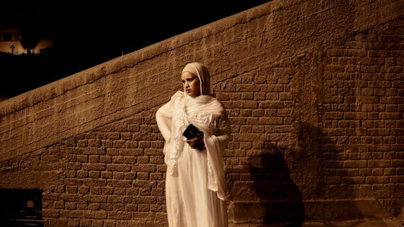 An Ethiopian Coptic Christian woman arrives for the Easter Eve service at St Mark's Cathedral in Cairo, Egypt, last week.